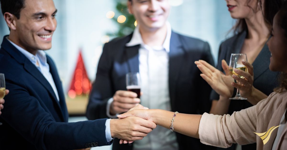 Business professions shaking hands at networking celebration